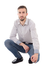 portrait of handsome man sitting isolated on white