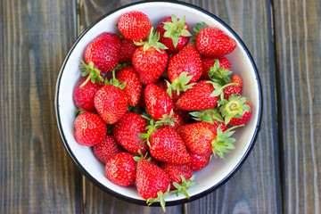 close up of strawberry on wooden background
