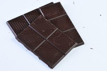 Chocolate pieces on a white background