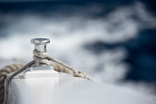 boat bollard detail on blue water background