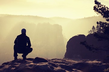 Tall hiker stand on peak Beautiful moment the miracle of nature 