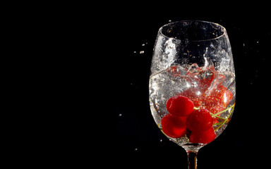 Cherries and Strawberry in glass of water