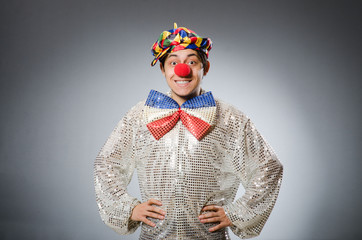 Funny clown against dark background