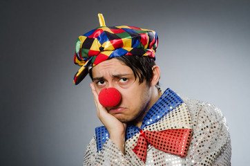 Funny clown against dark background