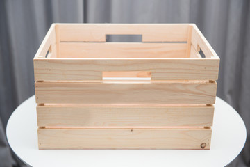 empty wooden box on white table