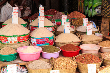 Baskets with rice and beans for sale on a market © pwollinga