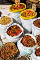 Big bags with colorful pasta for sale on a market