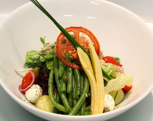 Delicious tuna salad served in a white plate.