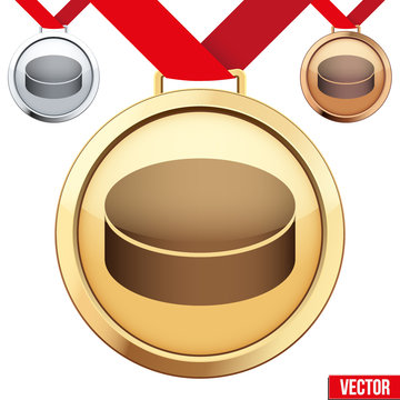 Gold Medal with the symbol of puck ice hockey inside