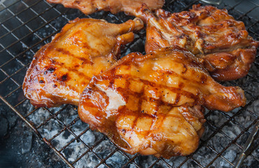 Chicken grilled on charcoal, Thailand market.