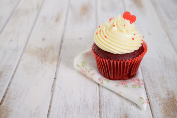 red velvet cupcakes with red heart on top