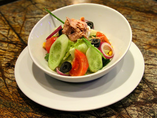 Delicious tuna salad served in a white plate.