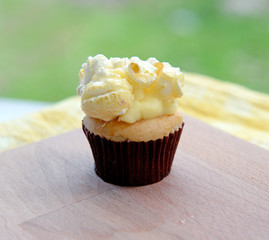 Cupcake with popcorn on top.