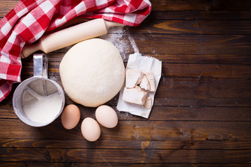 Dough on wooden background