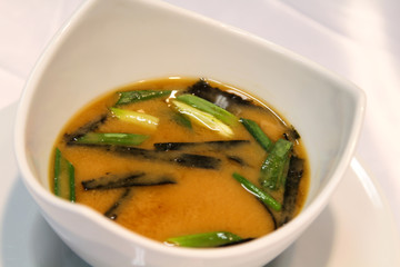 Delicious Kazakhstani soup served with greens, onions.