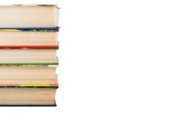 A stack of books in color covers isolated on white background. S