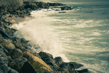 The stony shores of the Atlantic Ocean. Portugal. Toned