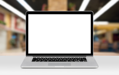 laptop mockup with white blank display on the desk in office 