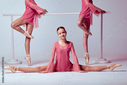 "Ballerinas stretching on the bar" Stock photo and royalty-free images