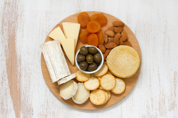 cheese with olives, dry fruits and cookies