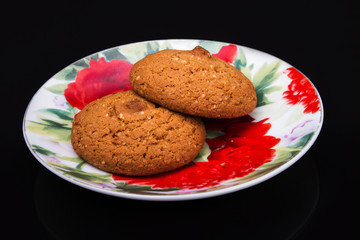 hot oatmeal on a black background with reflection