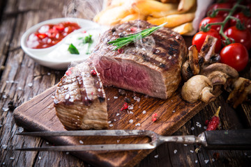 Beef steak on wooden table