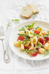 pasta with cherry tomatoes, arugula and Parmesan 