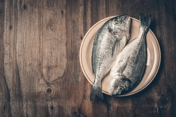 Healthy eating. Bream fish preparation. Seafood  - obrazy, fototapety, plakaty