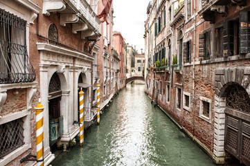 Narrow Venetian Canal Lined with Buildings