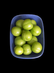 Green Plums Isolated On Black Background