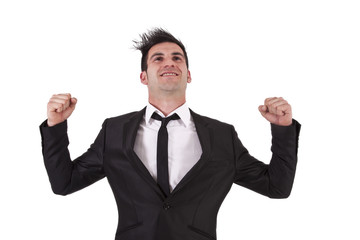 man with black suit with fists raised