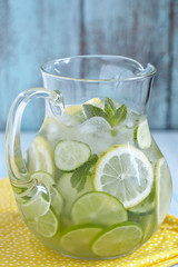 Fruit water in glass pitcher