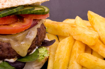 Quarter Pound Cheeseburger and fries on a slate platter