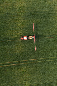 aerial view of harvest fields with tractor