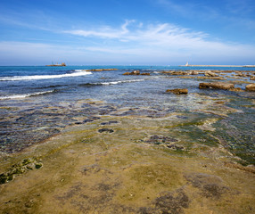 Seascape of Livorno coast with dam and lighthouse in the backgro