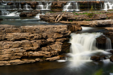 Many Waterfalls Cascading over Rocks