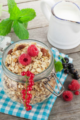 Healty breakfast with muesli, berries and milk