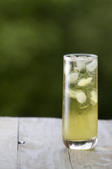 Green tea with ice in a tall glass