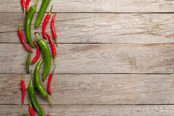 Keuken spatwand met foto Colorful chili peppers © karandaev