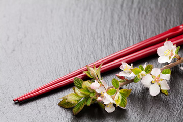 Japanese sushi chopsticks and sakura blossom © evgeeenius