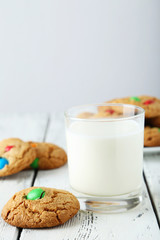 Cookies with colorful candy on white background