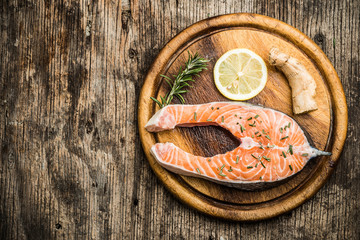 fresh raw salmon wooden cutting board