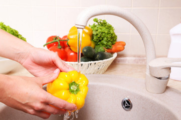 Vegetables washing in kitchen