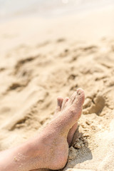 sandy feet on the beach