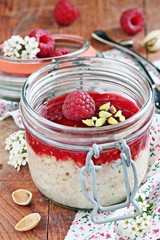 Overnight oats with fresh raspberry and pistachio. 