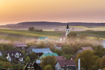 Sundown over village in Poland - obrazy, fototapety, plakaty