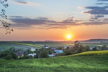 Sundown over village on Polish countryside