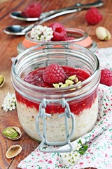 Overnight oats with fresh raspberry and pistachio. 