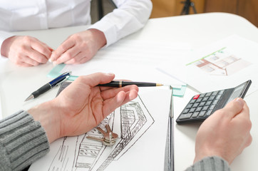 Naklejka premium Realtor showing the home prices