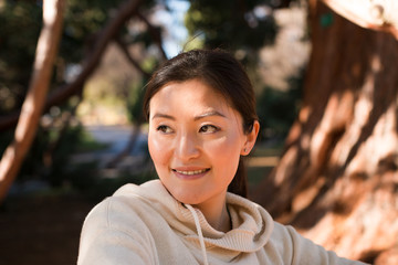 Smiling young korean woman outdoor